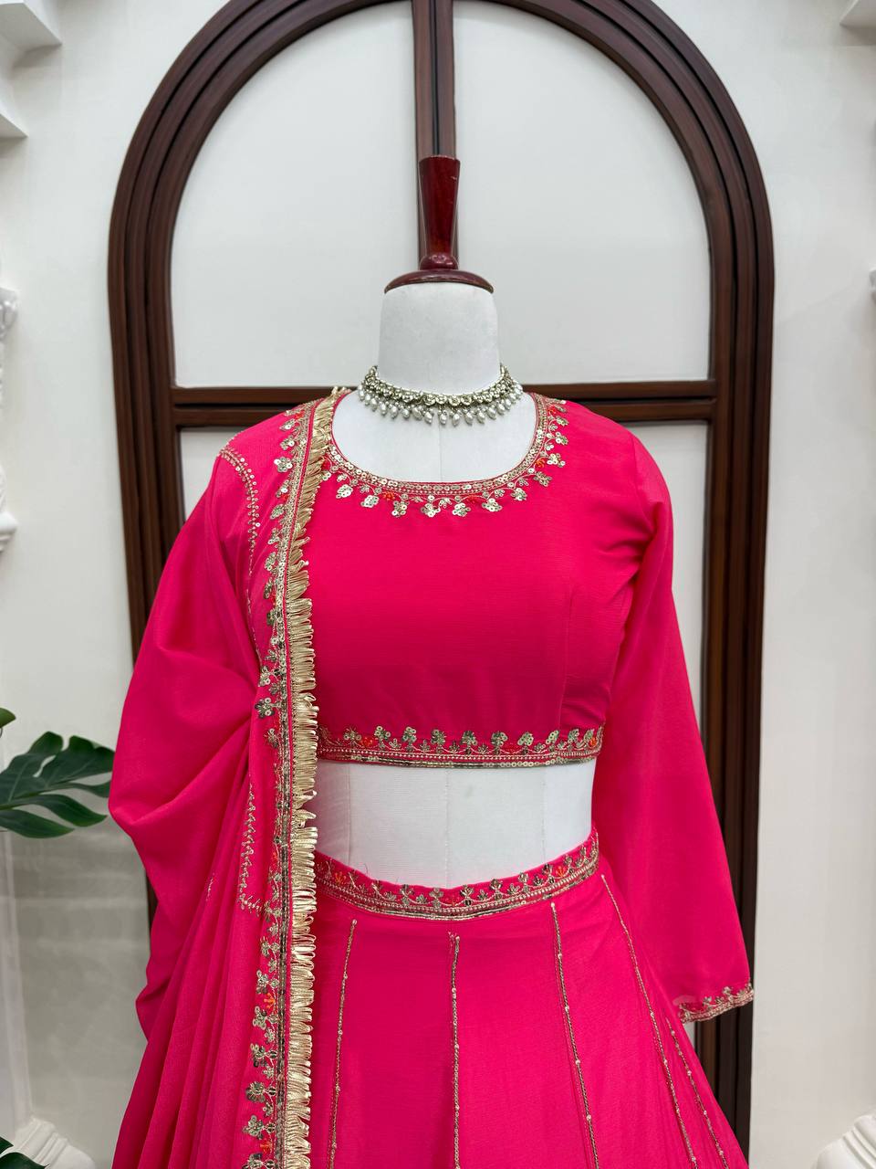 Radiant Rani Pink Silk Lehenga Choli Adorned with Opulent Heritage Floral Motifs and Intricate Zari Borders